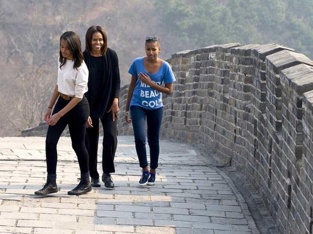 Michelle Obama walks with her daughters Malia and Sasha as they visit the Mutianyu section of the Great Wall of China in Beijing. (AP)
