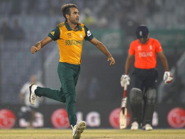 South Africa's Imran Tahir (L) celebrates the wicket of England's Jos Buttler during their ICC World Twenty20 match at the Zahur Ahmed Chowdhury Stadium in Chittagong. (AP Photo)