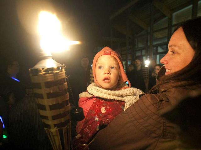 Students and visitors observe Earth Hour outside Fleming College's Frost Campus for Environmental Studies in Lindsay, Ontario. (Reuters)