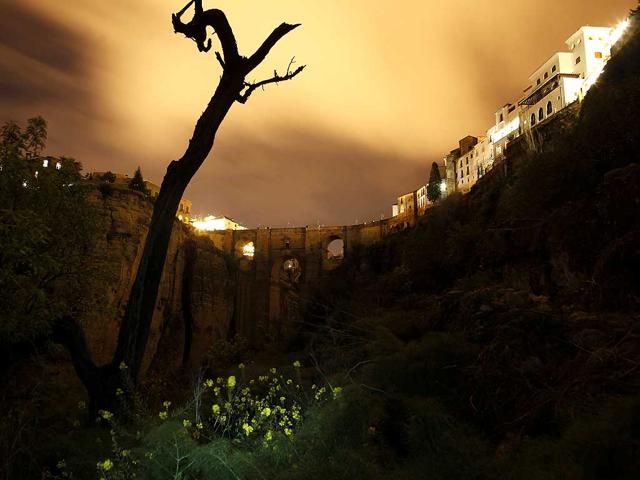 The "Puente Nuevo" (New Bridge) is seen during Earth Hour in Ronda, near Malaga, southern Spain. The Puente Nuevo is 120 metres (390 feet) high and the gorge of the river divides the city of Ronda. (Reuters)