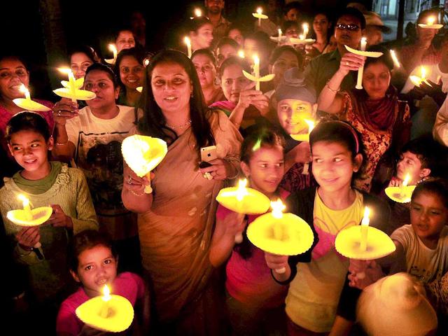 Teachers and school children during an awarness candle march to observe Earth Hour 2014 in Patiala.(PTI photo)