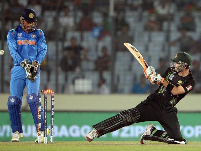 Australia's Glenn Maxwell (R) gets clean-bowled during their ICC World Twenty20 match against India at the Sher-e-Bangla National Cricket Stadium in Dhaka. (AFP Photo)