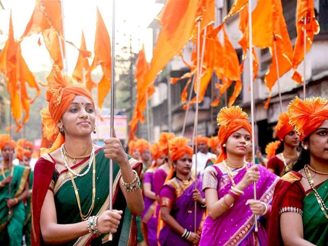 Maharashtrian women perform during 'Shobha Yatra' to welcome the Hindu New Year on occasion of Gudi Padwa in Dombivli near Thane. (PTI photo)