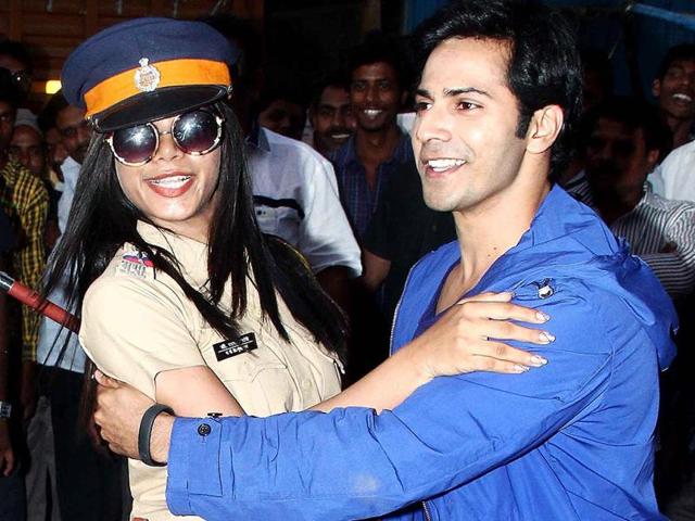 Shake a leg: Varun Dhawan dances with the officer.
