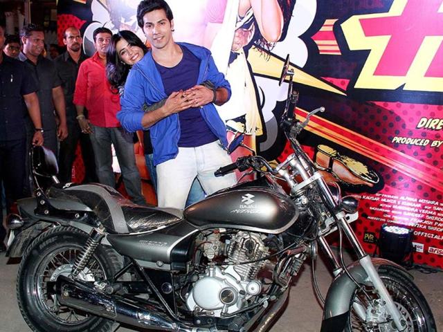 Taken for a spin: Ekta Kapoor gets a grip riding pillion as the hero of her latest venture, Varun Dhawan, is seen driving. This was Ekta's first bike ride.