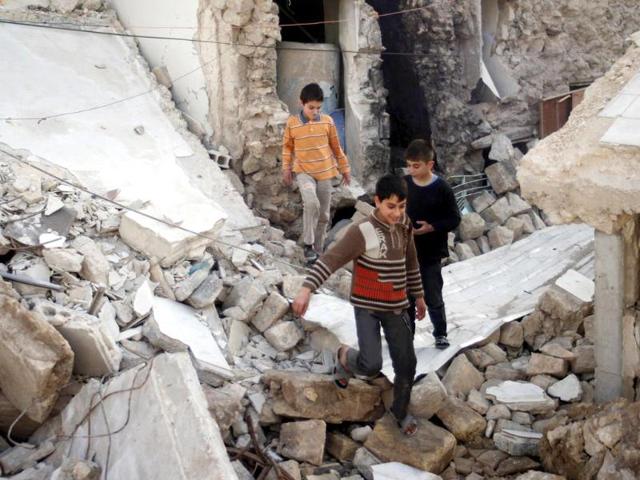 Boys-play-on-debris-of-damaged-buildings-in-the-old-city-of-Aleppo-Reuters-Photo