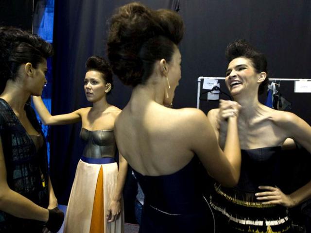 Models visit backstage before working at Mexican Fashion Week. (AP)