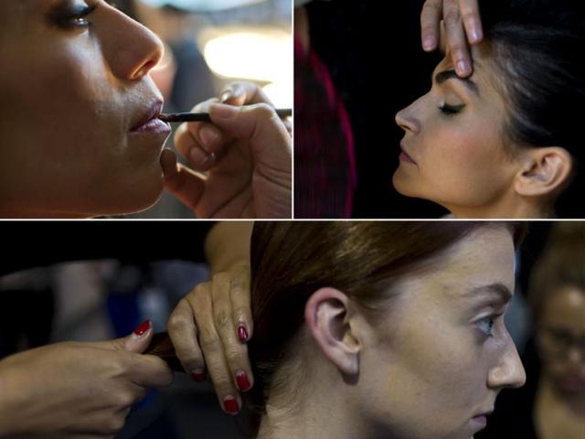 Models during makeup session on the backstage of the Mexican Fashion Week in Mexico City (left to right). (AFP)
