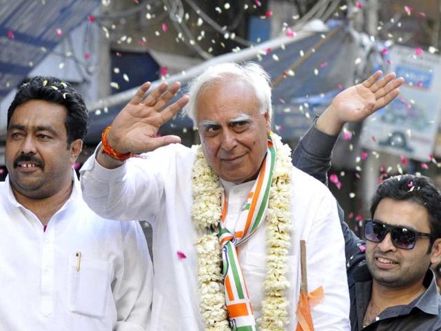 Congress' candidate from Chandni Chowk, Kapil Sibal, during a road show for the Lok Sabha election 2014 at Old Delhi. (Sonu Mehta/HT photo)