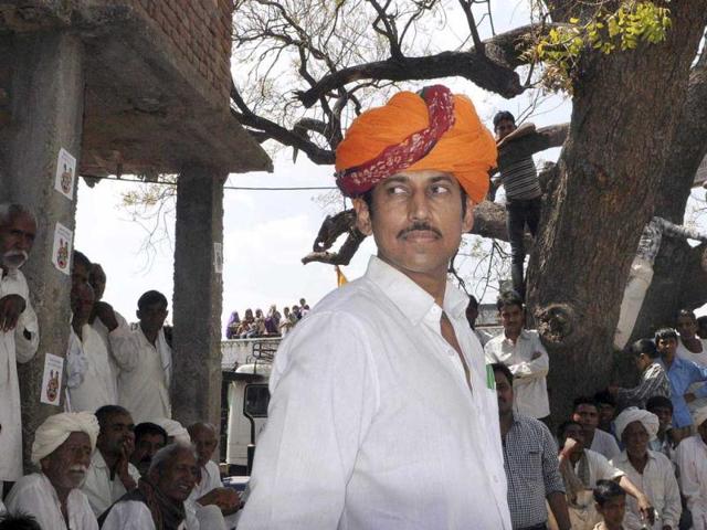 Olympian silver medalist and BJP's Lok Sabha candidate Colonel Rajyavardhan Singh (wearing turban) at a campaign meeting, in Kotputli village, in Jaipur. (Himanshu Vyas/HT Photo)