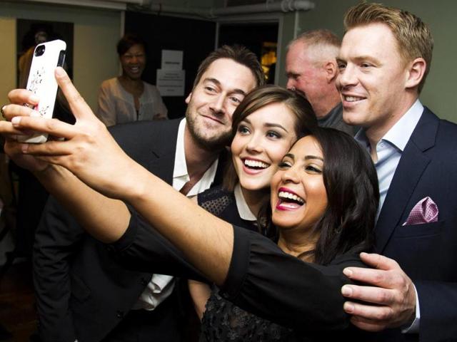 The bend-it-to-pose selfie - Yes, that was a Parminder Nagra joke. The actress strikes the perfect happy selfie pose with Ryan Eggold, Megan Boone and Diego Klattenhoff ahead of a shoot. (AP Photo)