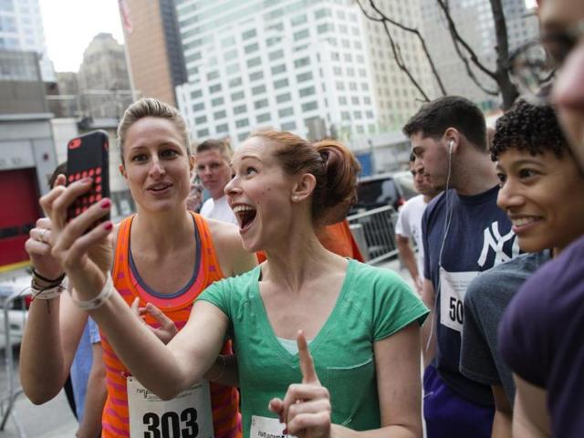 The woo hoo! selfie - These two are prepping to run up the World Trade Centre during "Runyon Up" and looks like she's totally loving the idea. You go girl! (AP Photo)