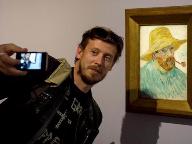 The inception selfie - A selfie, within a selfie, within a selfie. That's Van Gogh's famous self-portrait at an exhibition eerily titled Van Gogh Live. And that's an uncannily similar looking guy taking his version of a self-portrait with it. (AFP Photo)
