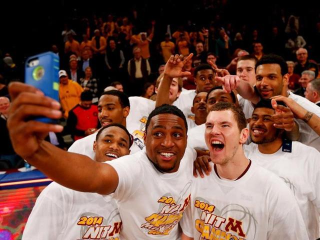 The winners selfie - Minnesota Golden Gophers celebrate after defeating the Southern Methodist Mustangs to win the 2014 NIT Championship in NY. Just look at those grins. (AFP Photo)