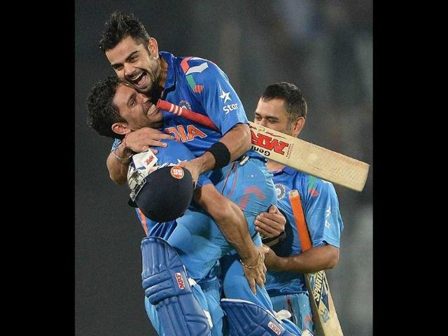 Yuvraj-Singh-picks-up-Virat-Kohli-2R-after-India-won-the-ICC-World-Twenty20-match-against-South-Africa-at-the-Sher-e-Bangla-National-Cricket-Stadium-in-Dhaka-AFP-Photo