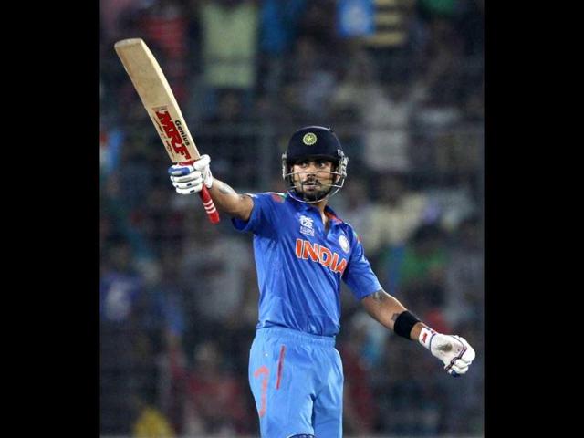 Virat Kohli celebrates after scoring a half century against South Africa during their ICC World Twenty20 match at the Sher-E-Bangla National Cricket Stadium in Dhaka. (Reuters Photo)