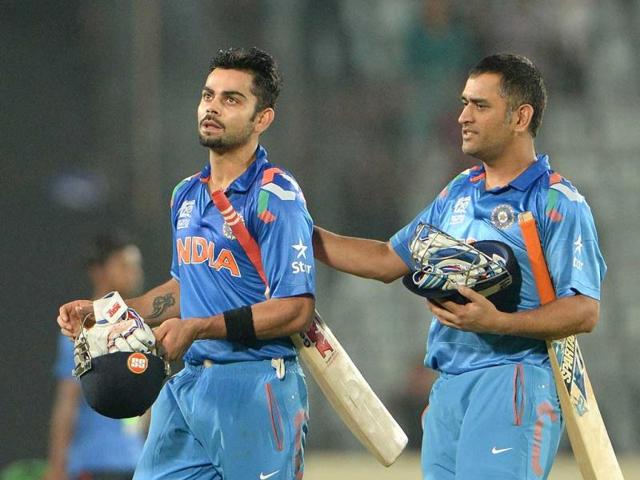 MS Dhoni (R) greets Virat Kohli (L) after India won the ICC World Twenty20 match against South Africa at the Sher-e-Bangla National Cricket Stadium in Dhaka. (AFP Photo)