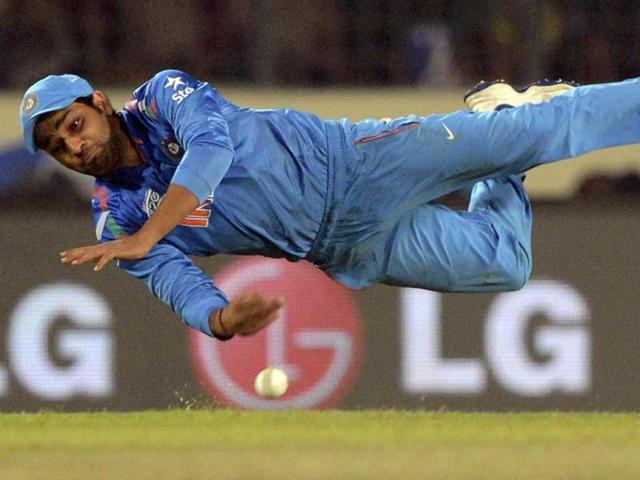 Rohit Sharma goes horizontal as he throws a ball during their ICC World Twenty20 match against Sri Lanka at the Sher-e-Bangla National Cricket Stadium in Dhaka. (AFP Photo)