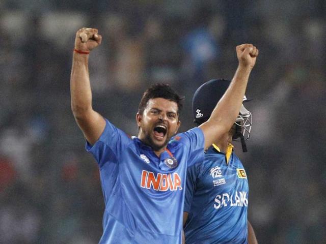 Suresh Raina (L) celebrates the wicket of Sri Lanka's Mahela Jayawardena during their ICC World Twenty20 final match in Dhaka, Bangladesh. (AP Photo)