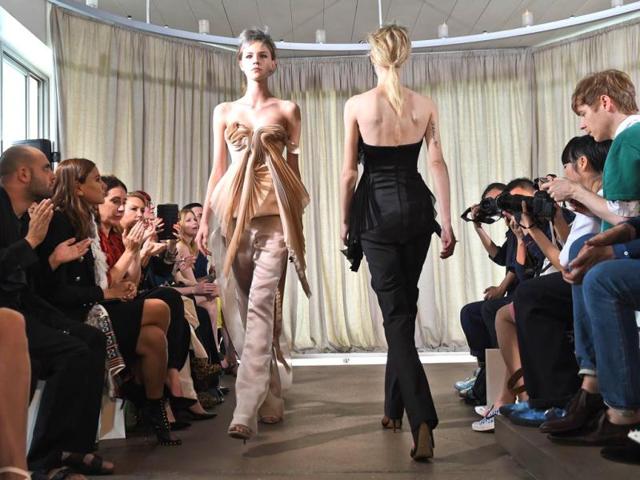 Models parade outfits by Australian designer Kym Ellery during a showing of her label Ellery at Fashion Week Australia in Sydney. (AFP)