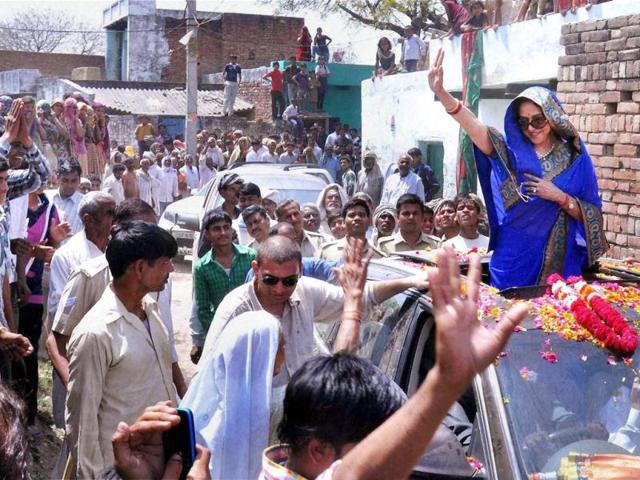 It’s raining Bollywood stars on poll street. Politicians, aware of the huge impact that celebrities have on people, have roped in several film and sports personalities to help them campaign for the ongoing general elections. Hema Malini waves to crowds in Mathura. (HT PHOTO)