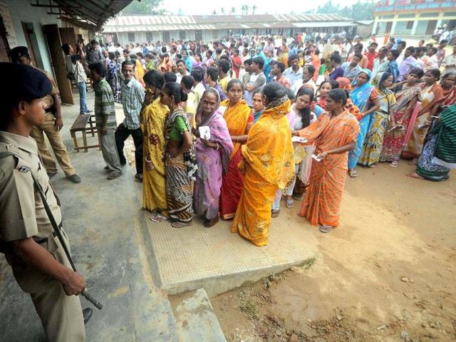 People wait to cast their votes during the first phase of Lok Sabha elections in Agartala on Monday. The country's 814-million electorate will vote in stages in the Lok Sabha elections over the next five weeks. (PTI Photo)