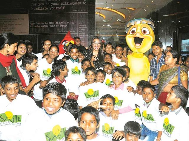 Sonakshi Sinha is surrounded by children at a movie screening that she hosted for them. (Photo: Prodip Guha)