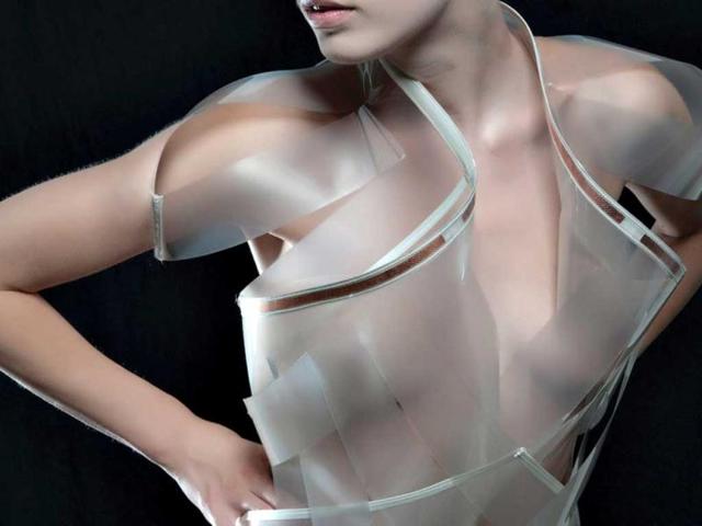 Intimacy is a high-tech fashion project exploring the relation between intimacy and technology. Its high-tech garments entitled 'Intimacy White' and 'Intimacy Black' are made out of opaque smart e-foils that become increasingly transparent based on close and personal encounters with people. (Photo: Studio Roosegaarde)