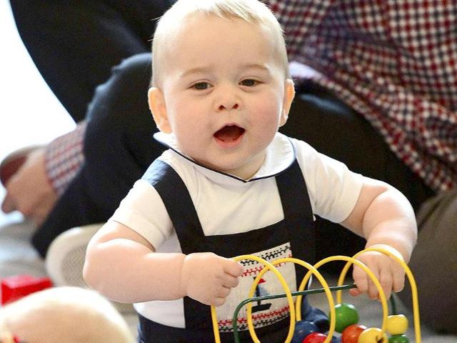 Prince George plays with a toy at a Plunket play group event in Wellington during his 19-day official visit with his paresnts to New Zealand and Australia.(Reuters photo)