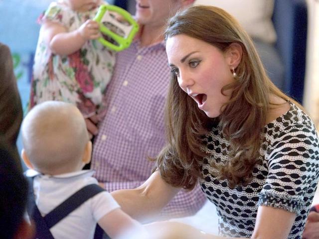 Prince George plays with his mother, Catherine, the Duchess of Cambridge, during a visit to Plunket nurse and parents group in Wellington. (AP photo)