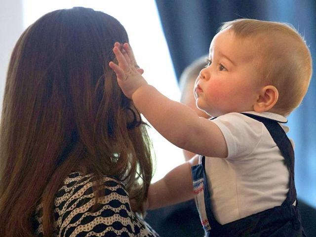 Catherine, Duchess of Cambridge, holds her son Prince George during a Plunket nurse and parents' group event in Wellington. (Reuters photo)