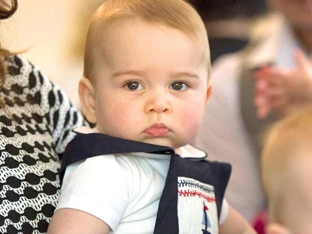 Catherine, the Duchess of Cambridge, holds Prince George during a visit to Plunket nurse and parents group in Wellington, New Zealand. (AP photo)