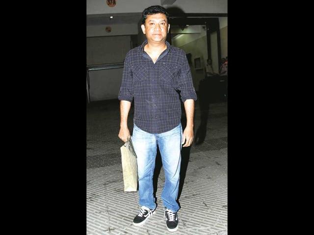 Ken Ghosh poses for the shutterbugs at Huma Quereshi's house warming party.