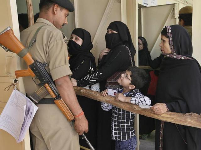 Voters turn up at polling booths to cast their votes for Lok Sabha Elections 2014 at Chandni Chowk areain in New Delhi. (Raj K Raj/HT Photo)