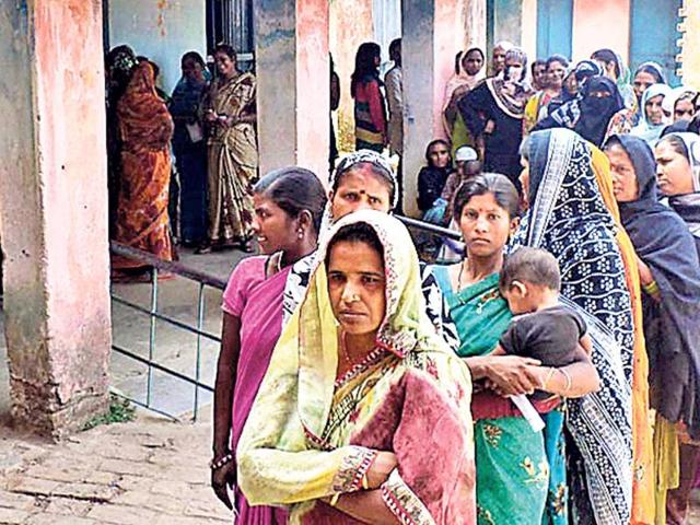 Women-wait-to-cast-their-vote-at-a-booth-in-Saryu-village-on-Thursday-Diwakar-Prasad-HT-Photo