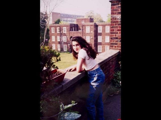 A young Amy outside her Nan’s flat in Southgate. (AFP)