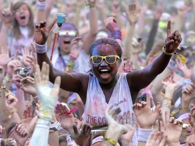 Participants cheer after finishing The Color Run in Paris. (Reuters photo)