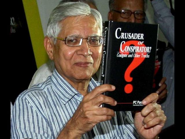 Former-coal-secretary-PC-Parakh-poses-for-photographs-with-his-book-Crusader-or-Conspirator-during-its-release-in-New-Delhi-PTI-photo