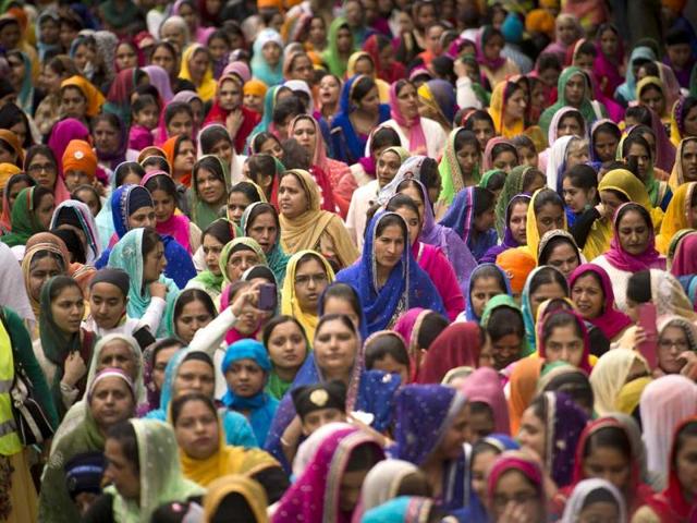 Indian Sikhs watch a procession in Bobigny, near Paris, during celebrations for Vaisakhi, the Sikh New Year Festival, which also commemmorates the founding of the Khalsa (Sikh community) by the tenth Guru (Guru Gobind Singh) in 1699. (AFP Photo)