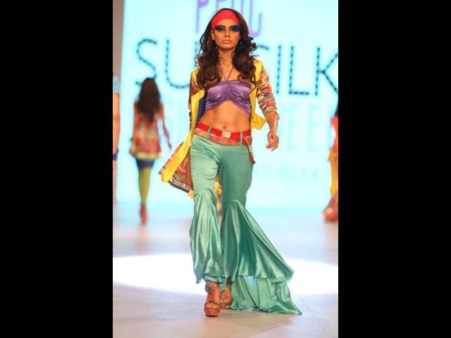 A model showcasing a dress designed by Rizwan Beyg at a fashion show. (AP Photo) A model showcasing a dress designed by Rizwan Beyg at a fashion show. (AP Photo)
