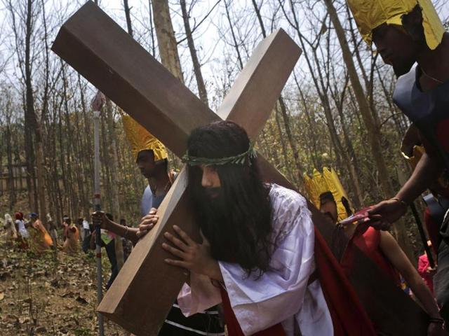 Christian devotees enact the crucifixion of Jesus Christ to mark Good Friday in Gauhati. (AP photo)