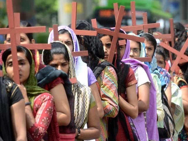 Christian devotees carry crosses as they take part in a procession in remembrance of the crucifixion of Jesus Christ to mark Good Friday in New Delhi. (AFP photo)