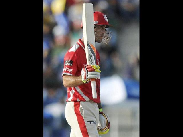 Glenn Maxwell of Kings XI Punjab raises his bat after scoring a half century during their IPL 7 match against Chennai Super Kings at the Al Zayed Cricket Stadium, Abu Dhabi. (PTI Photo)