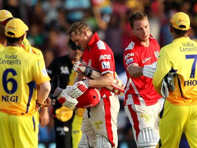 David Miller shakes hands with MS Dhoni captain of Chennai Super Kings after their IPL 7 match at the Al Zayed Cricket Stadium, Abu Dhabi. (PTI Photo)