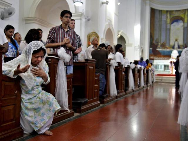 People are busy in prayer at Sacred Heart Cathedral church during Good Friday ceremony in New Delhi. (HT photo/Subrata Biswas)