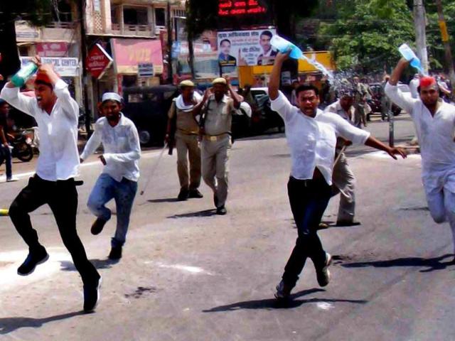 Samajwadi Party workers attempt self-immolation with kerosene oil during a protest against EC ban on the party leader Azam Khan in Allahabad. (PTI photo)
