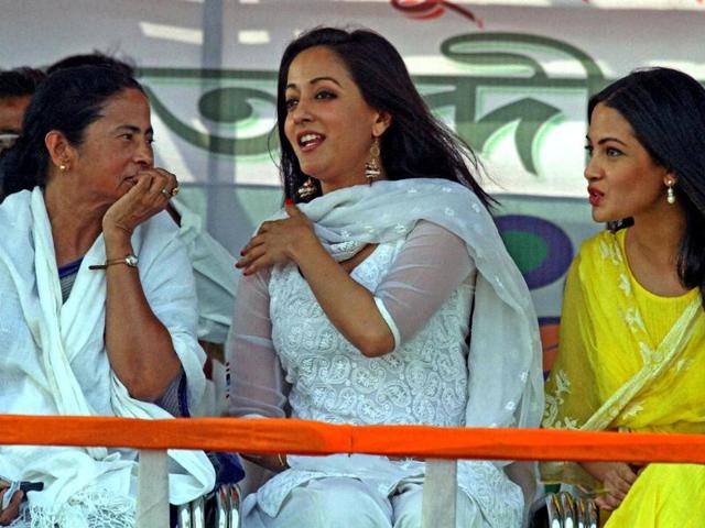 West Bengal CM and TMC supremo Mamata Banerjee talks with actress Raima Sen and Ria Sen during an election campaign meeting at Suri in Birbhum district. (PTI photo)