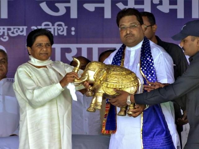 BSP chief Mayawati receives a model of an elephant, the party's electoral symbol, by party's candidate Yogesh Divedi during an election campaign rally in Mathura. (Reuters photo)