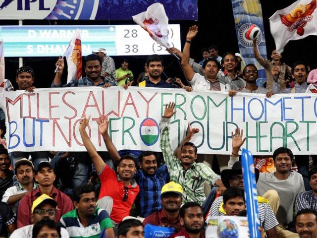 Fans watch a IPL 7 match between Sunrisers Hyderabad and Rajasthan Royals in Abu Dhabi. (PTI Photo)