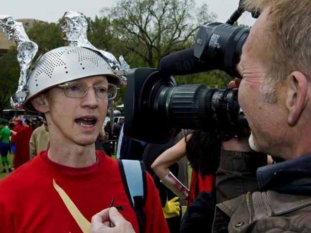 David Gayer, from Silver Spring, MD, wears a colander strainer as a helmet for his Flash costume at Awesome Con 2014 in Washington. (AFP photo)